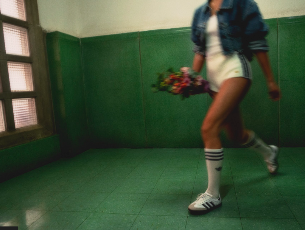 a girl running wearing adidas originals sneaker