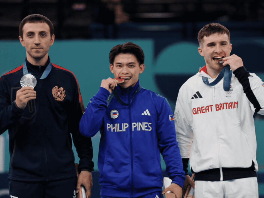 Biting olympic medal